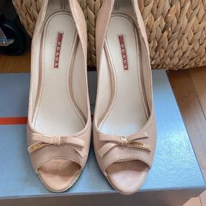 Authentic Prada wedges , leather nude